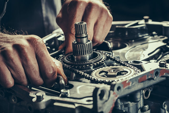 Man Working on Car Parts | Transmission and Clutch Repair | ATL Laredo