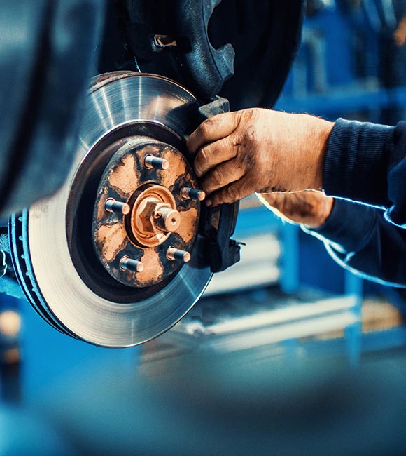 man working on brakes