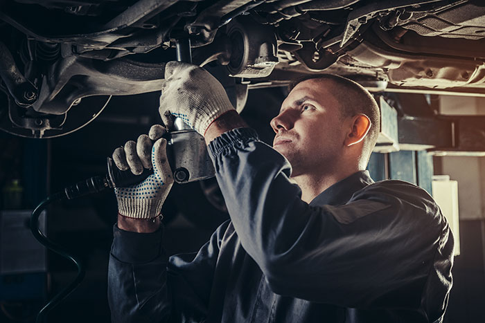 Man Working Underneath a Car | Tune-Ups